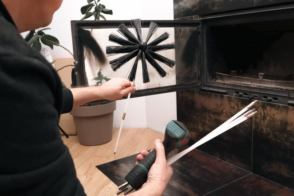 a person holding a brush and a tool