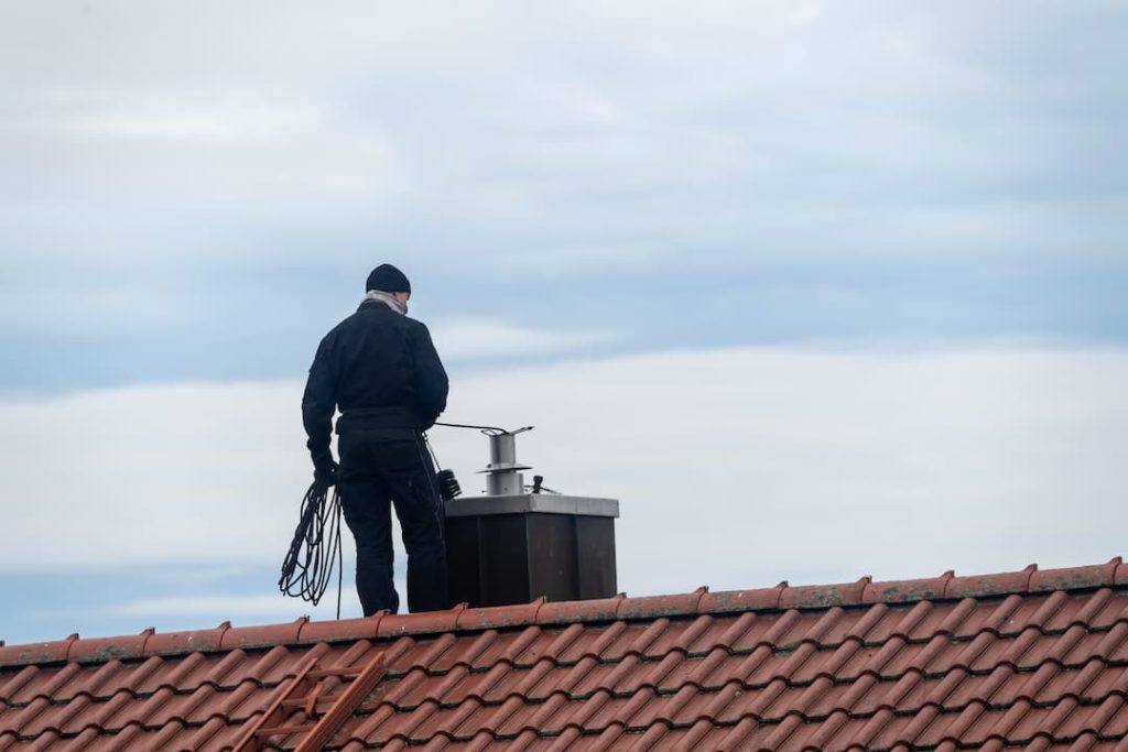 a man standing on a roof